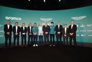 Fernando Alonso (C) with the Aston Martin F1 Team at the Silverstone Headquarters. Source: Getty
